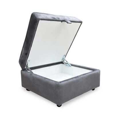 Side view of the Felix footstool, showcasing the smooth velvet texture and the modern industrial look of the cross-base metal legs.