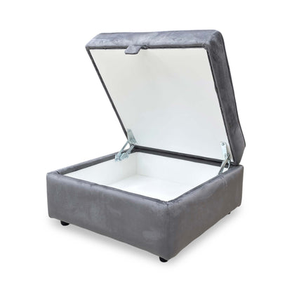 Side view of the Felix footstool, showcasing the smooth velvet texture and the modern industrial look of the cross-base metal legs.