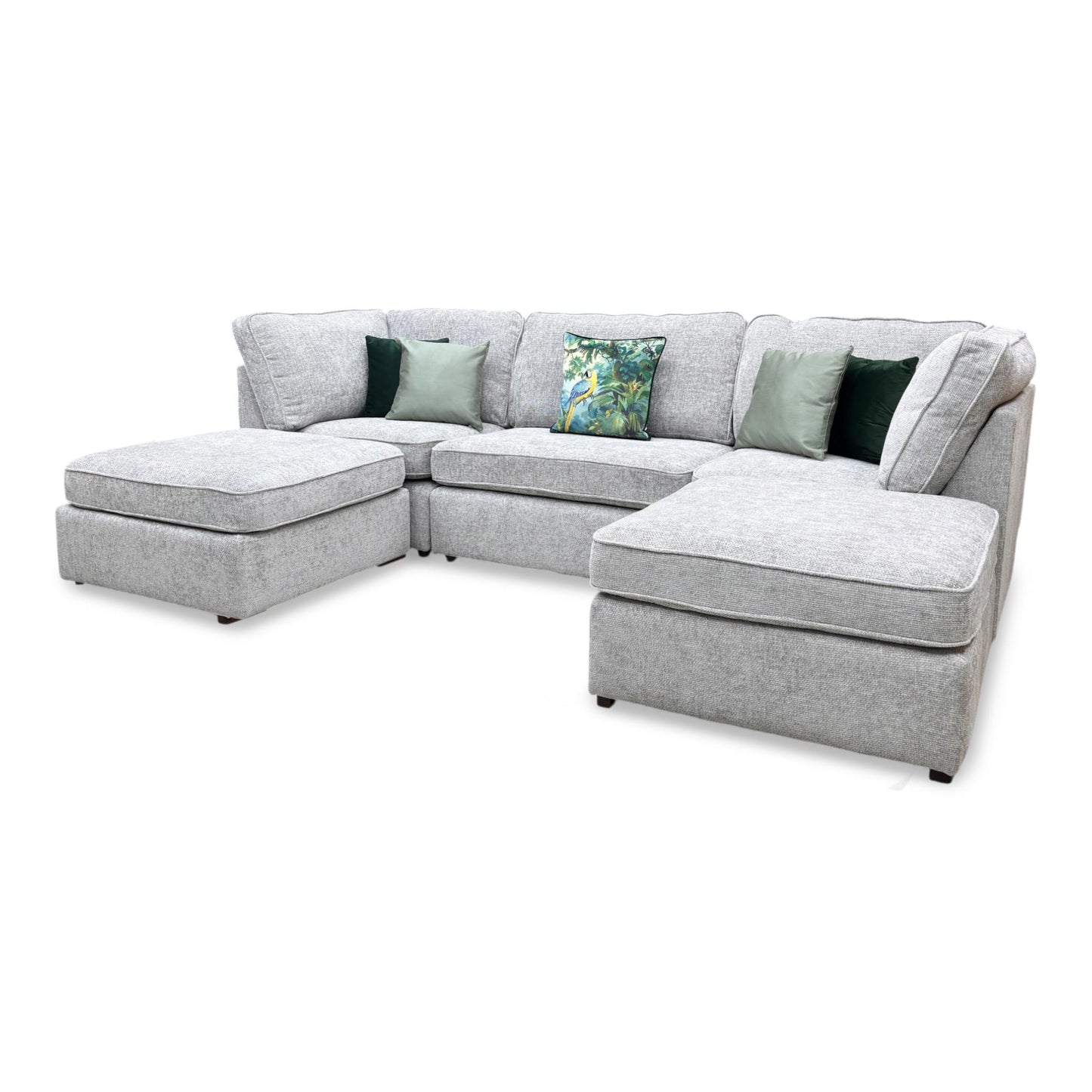 The Emilia U-shape sofa in Silver, highlighting the rebound quality of the seat cushions and the plush, soft-to-the-touch feel of the upholstery.