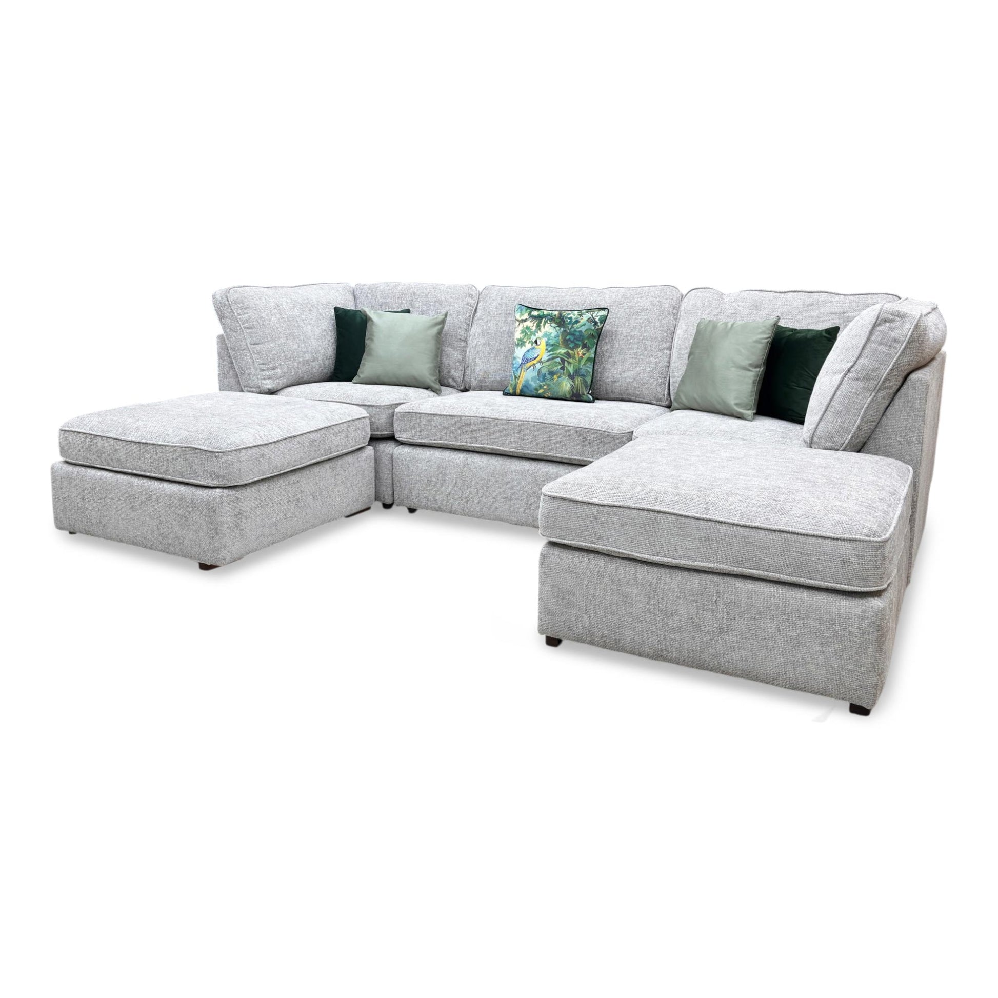 The Emilia U-shape sofa in Silver, highlighting the rebound quality of the seat cushions and the plush, soft-to-the-touch feel of the upholstery.