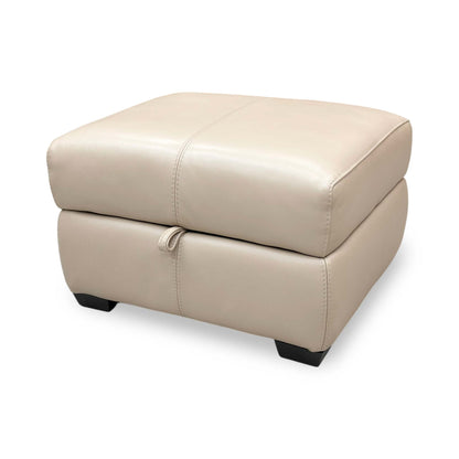 Side view of the Elixir footstool in Pebble Cream, showcasing the contemporary silhouette and elegant feature stitching.