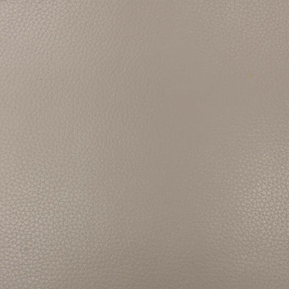 Close-up of the Pebble Cream leather texture, emphasizing the high-quality natural grain and soft-touch finish of the upholstery.