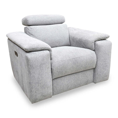 Side profile of the Nicoletti Davide armchair, emphasizing its sleek, modern lines, padded armrests, and integrated power control buttons.