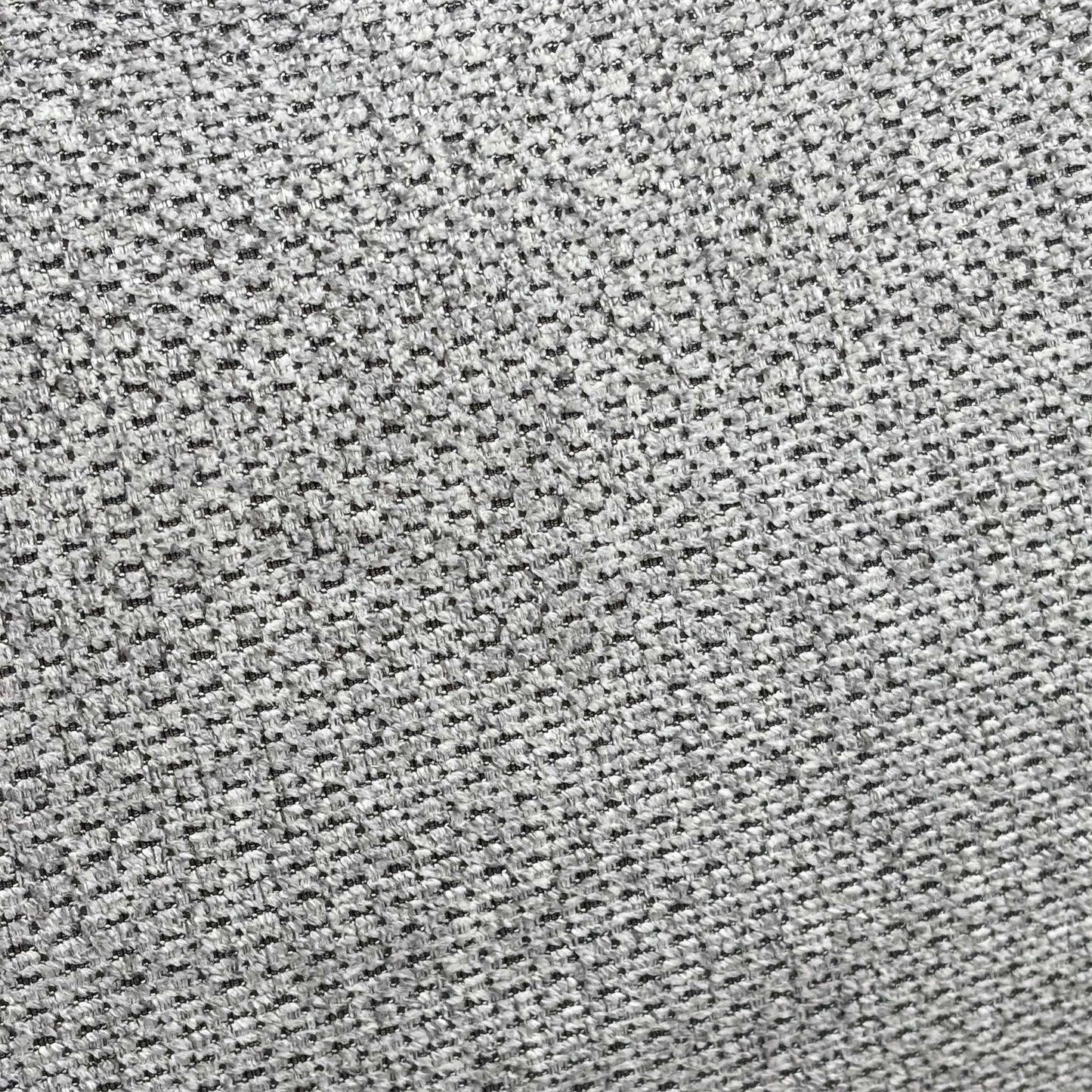 Close-up shot of the premium light grey fabric upholstery on the Nicoletti Davide chair, highlighting the fine texture, quality weave, and precise hand-stitching.