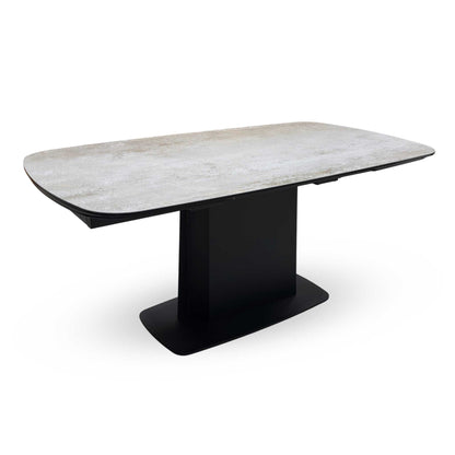 Side view of the Catalina table fully extended, showcasing the expansive surface area and the symmetrical aesthetic of the extension leaves.