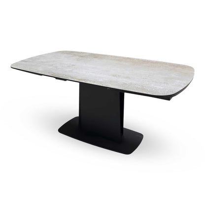 Side view of the Catalina table fully extended, showcasing the expansive surface area and the symmetrical aesthetic of the extension leaves.