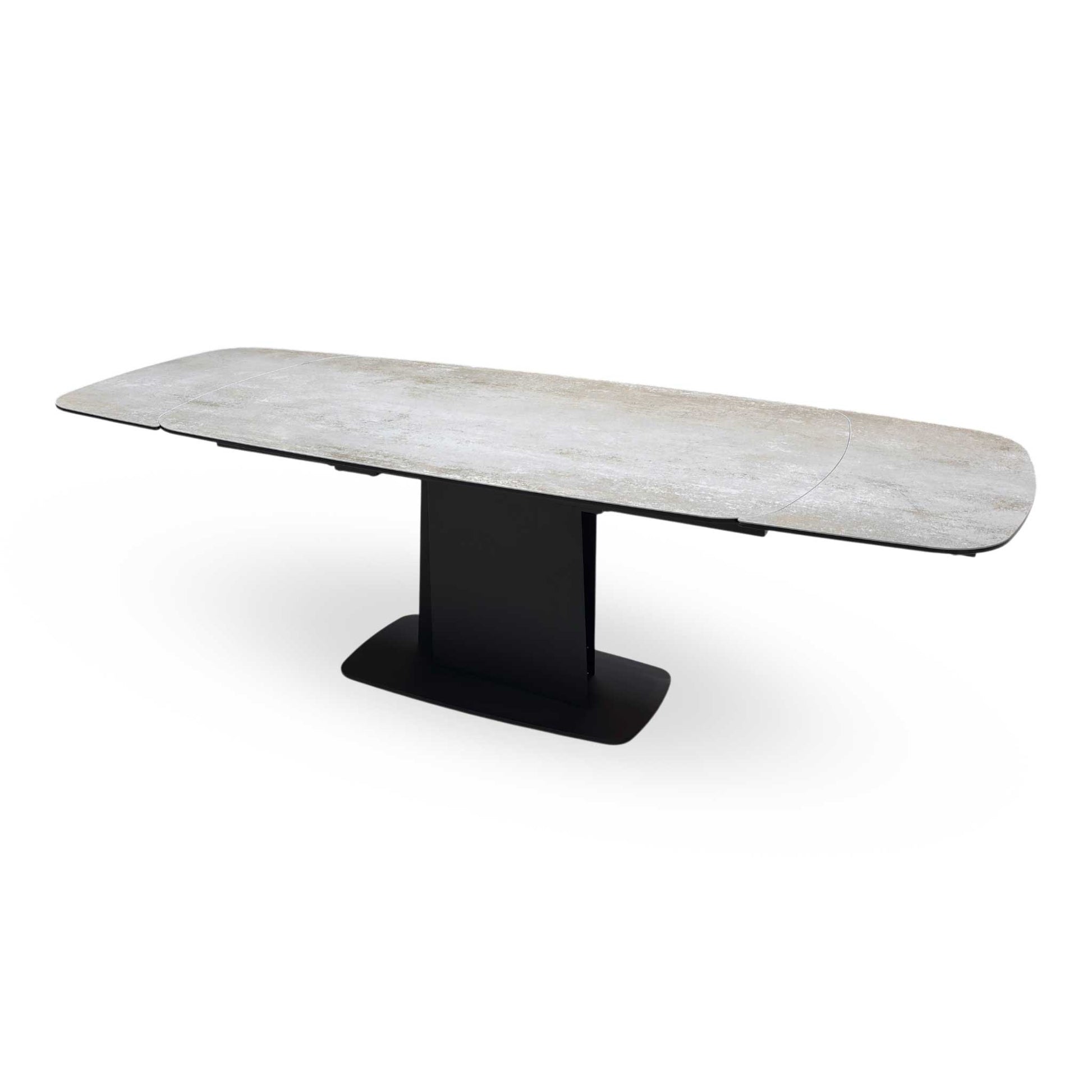 Side view of the Catalina table fully extended, showcasing the expansive surface area and the symmetrical aesthetic of the extension leaves.