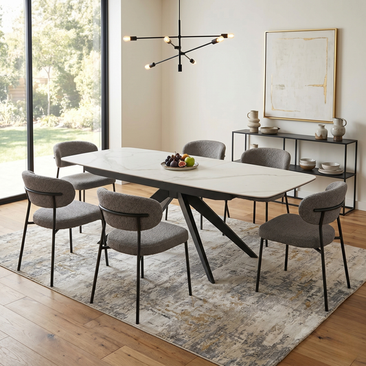 Dining room view for the Carrera dining table, highlighting the durable heat-resistant white ceramic surface and the smooth pop-up extension mechanism.