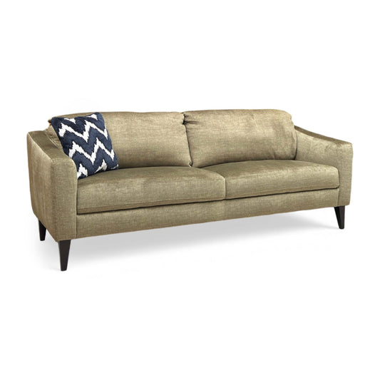 Full view of the Oslo 3-seater sofa upholstered in Vogue Olive Green velvet, featuring a sleek mid-century modern design with piped edge detailing and tapered black legs.