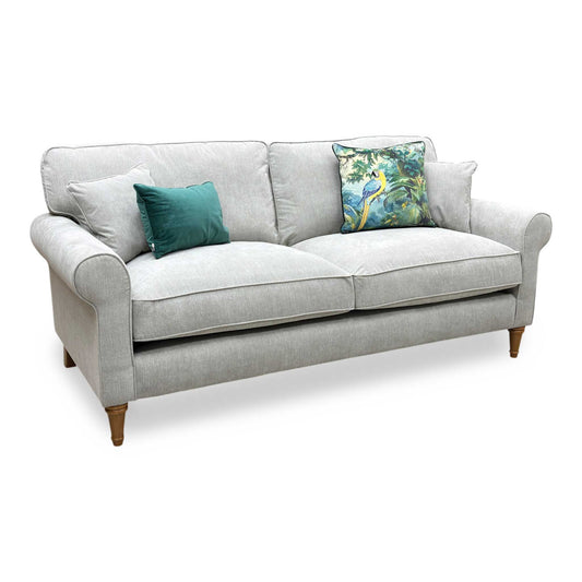Full view of the William 3-seater sofa, showcasing a stately modern profile upholstered in premium silver grey fabric with deep comfort cushioning and clean tailored lines.