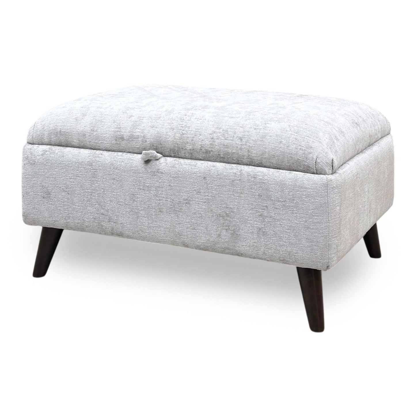 Side profile of the ‘Sanremo’ storage ottoman, highlighting its neat proportions, plushly padded top profile, and low-profile, floor-protecting feet.