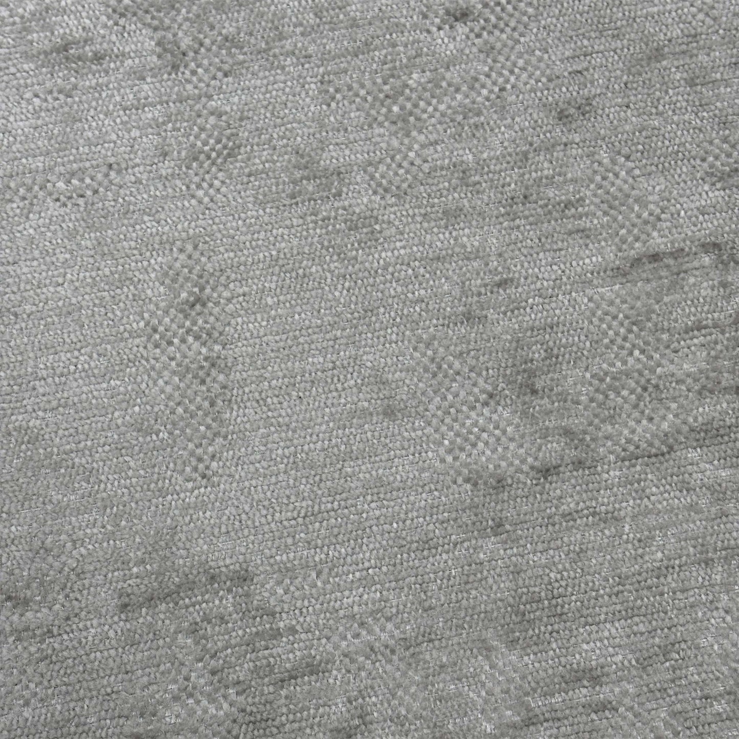 Close-up shot of the Silver fabric on the ‘Sanremo’ footstool, showcasing the rich multi-tonal grey and silver woven fibers, soft-touch texture, and high-quality stitched detailing.