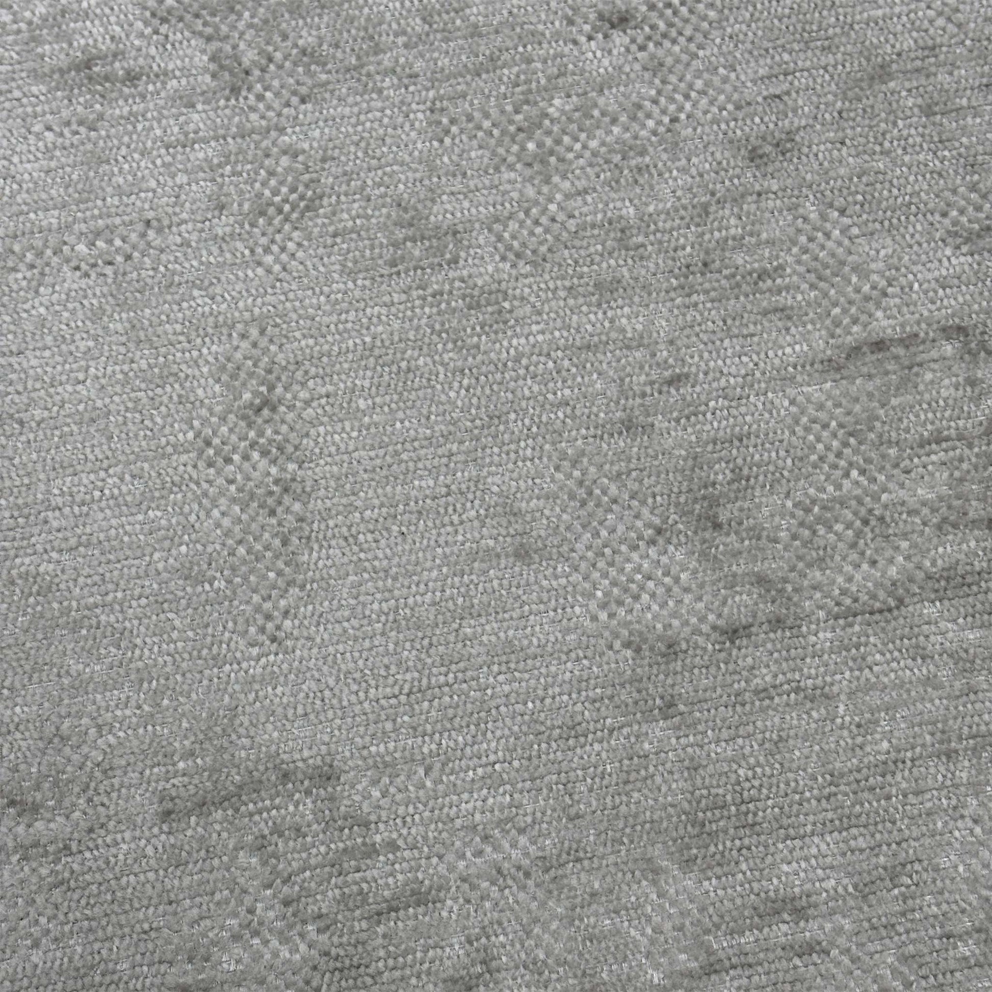 Close-up shot of the Silver fabric on the ‘Sanremo’ footstool, showcasing the rich multi-tonal grey and silver woven fibers, soft-touch texture, and high-quality stitched detailing.