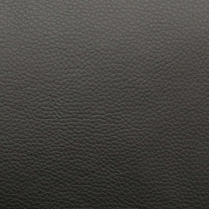 High-definition close-up shot of the premium black leather upholstery, highlighting its authentic fine-grain texture, supple matte finish, and clean, durable seams.