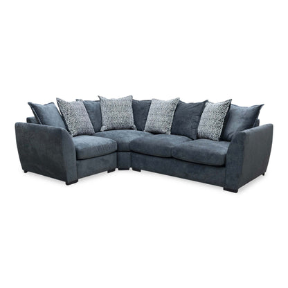 Full view shot of the Havana left-hand corner sofa, upholstered in a premium charcoal grey fabric, featuring a generous chaise lounging section, plush seating, and modern block feet.