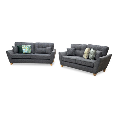 Side profile view of a Halstow sofa, emphasizing the supportive angle of the backrest, clean track arm padding, and its streamlined living room footprint.