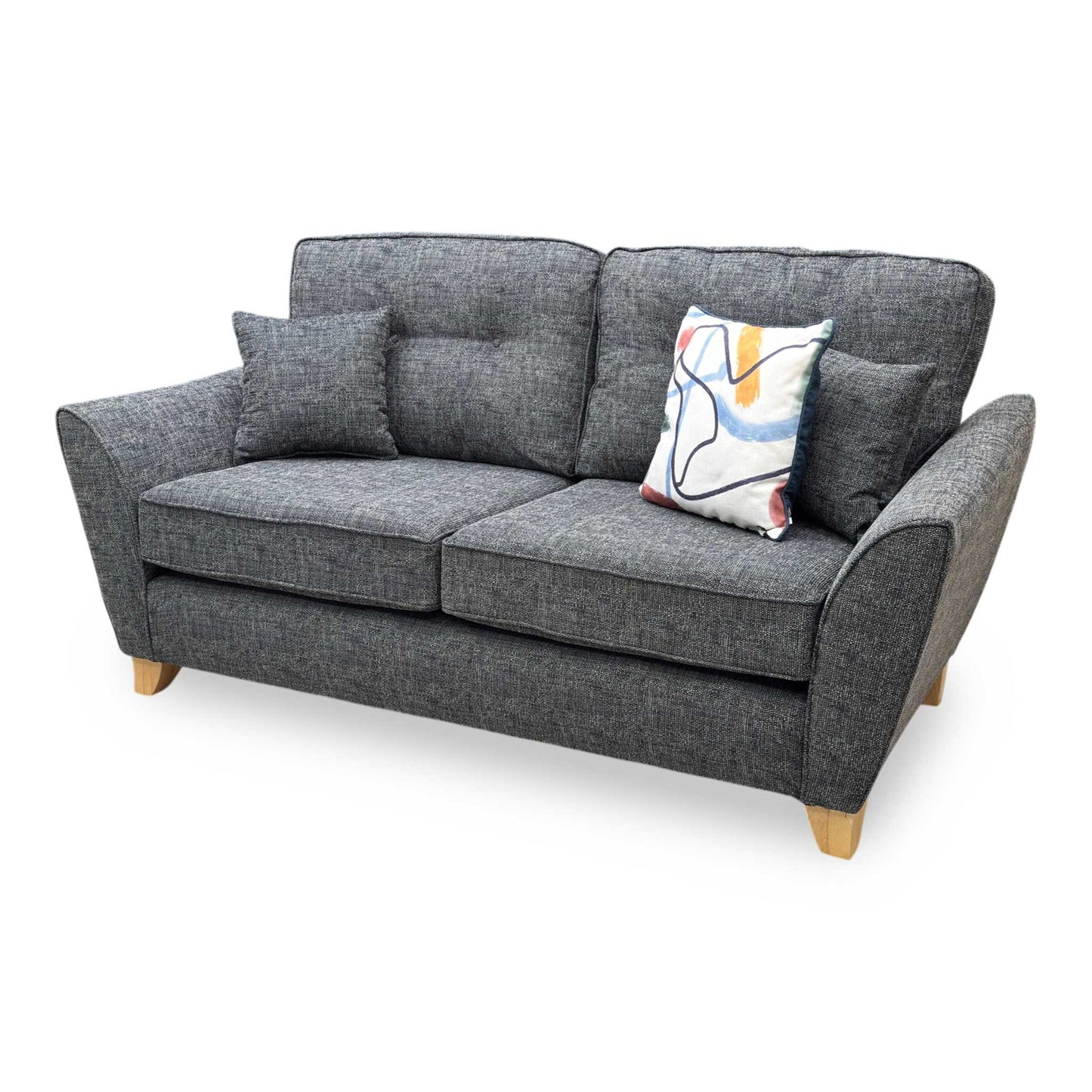 Side profile of the ‘Halstow’ sofa, highlighting the ergonomic slant of the backrest, clean neat tailored edges, and minimalist, angled black metal leg structure.
