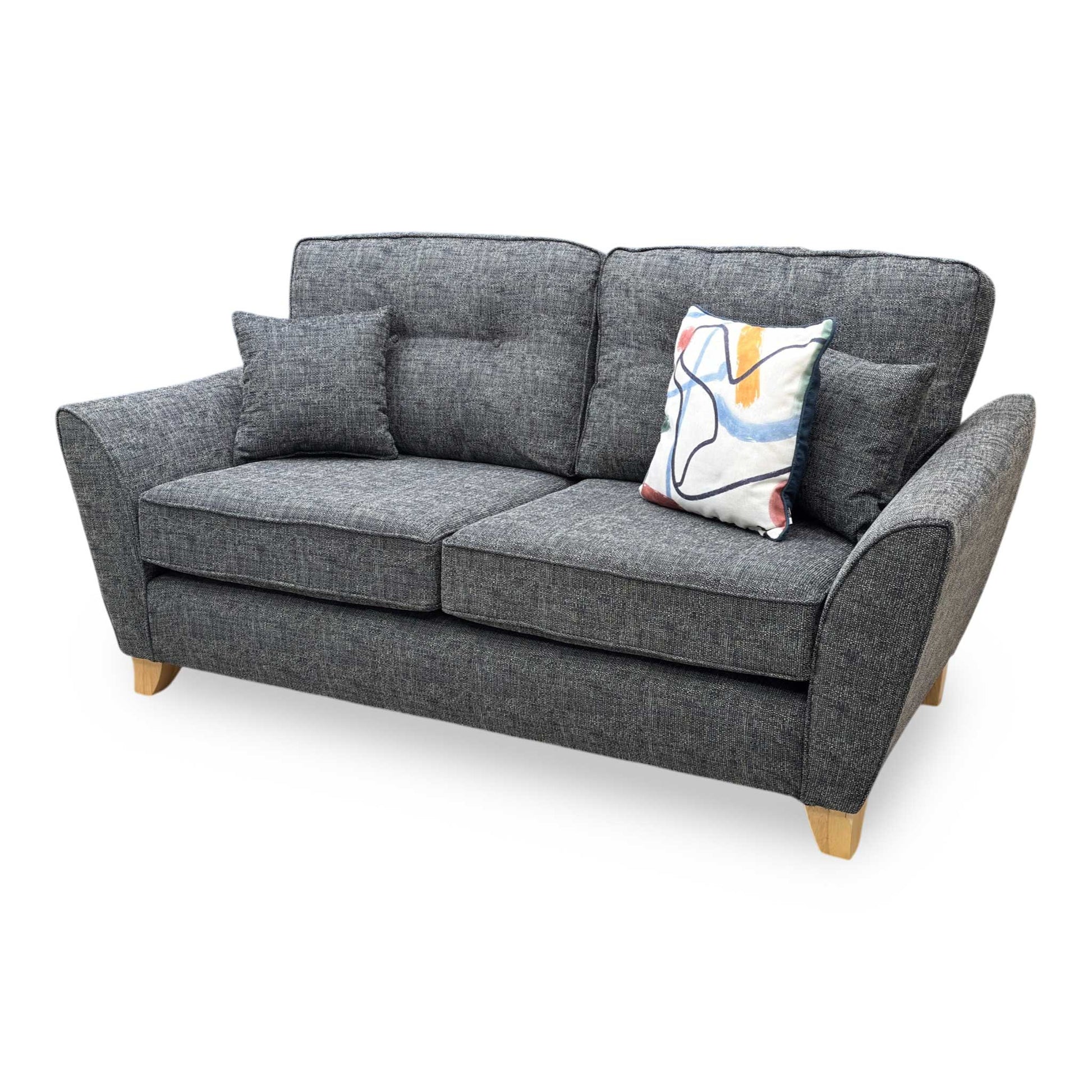 Side profile of the ‘Halstow’ sofa, highlighting the ergonomic slant of the backrest, clean neat tailored edges, and minimalist, angled black metal leg structure.