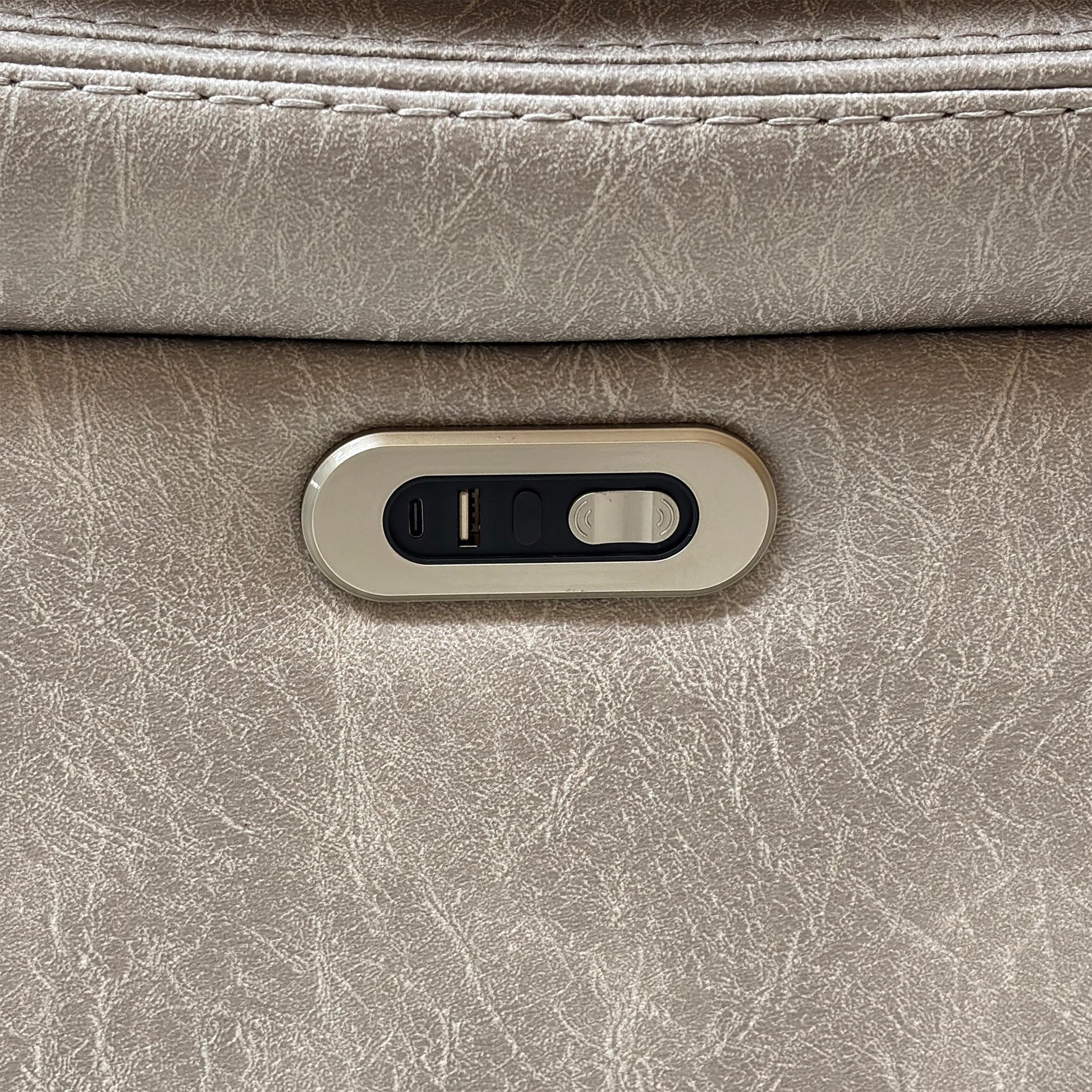 Close-up shot of the integrated sleek power control panel on the outer armrest, displaying the smooth touch buttons and handy built-in USB charging port.