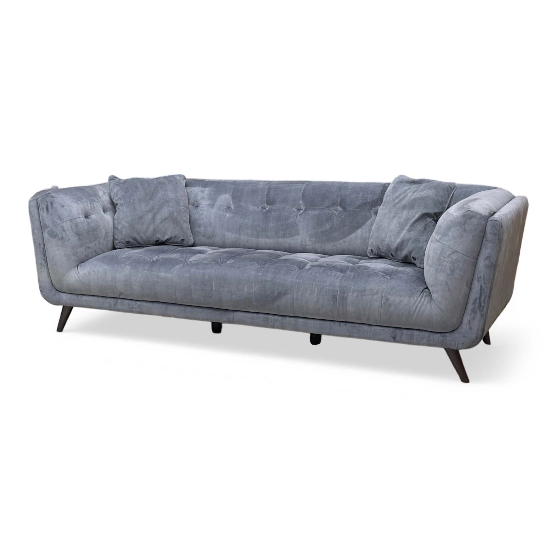 Side profile of the ‘Rene’ dining or living area sofa, highlighting the ergonomic slant of the backrest, clean tailored edges, and sleek, tapered black metal leg frame.