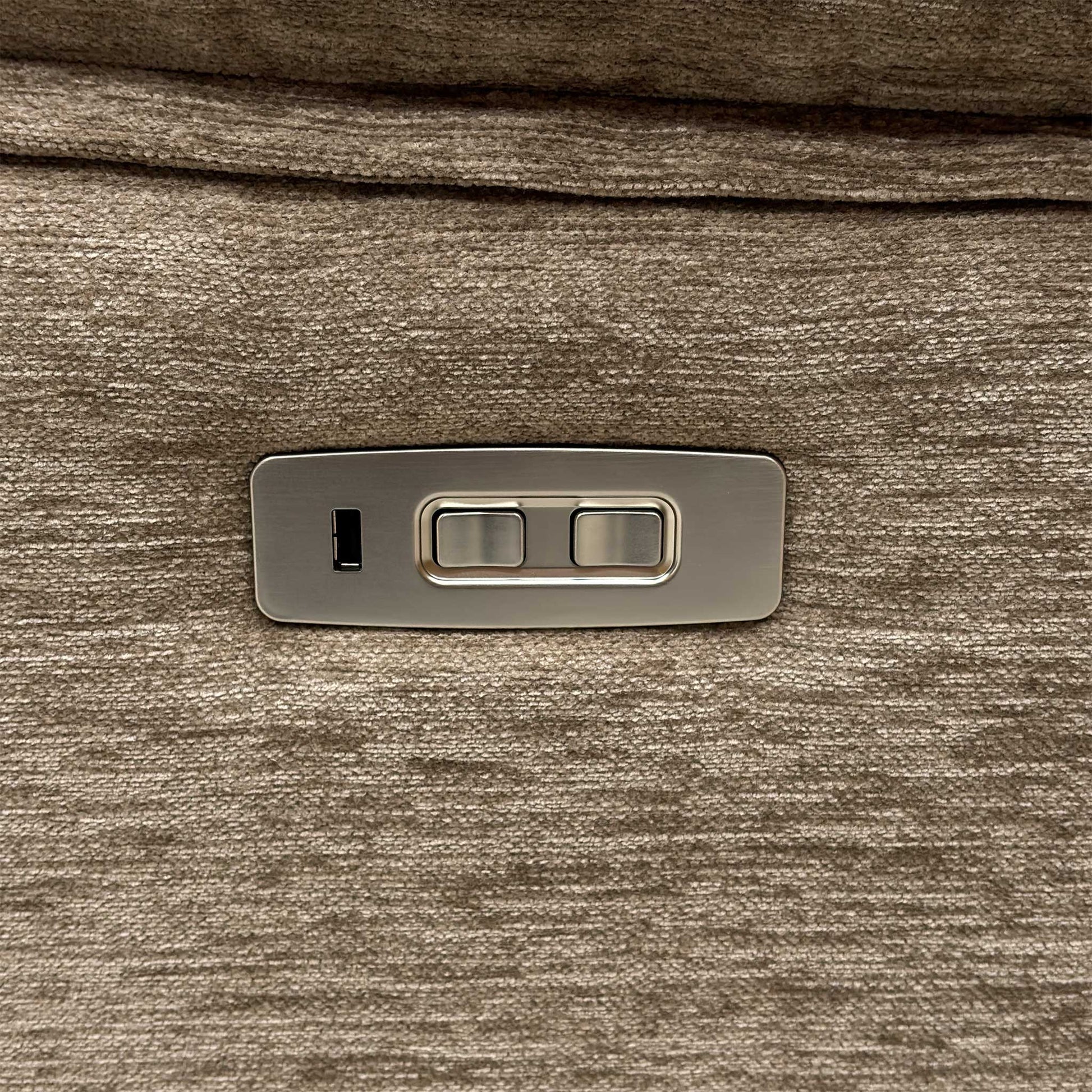 Detail shot of the integrated metallic power touch control switches on the side panel, featuring smooth reclining activation and a built-in USB port for convenient device charging.