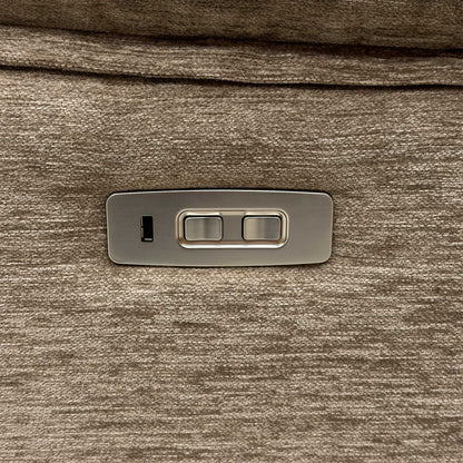 Detail shot of the integrated metallic power touch control switches on the side panel, featuring smooth reclining activation and a built-in USB port for convenient device charging.