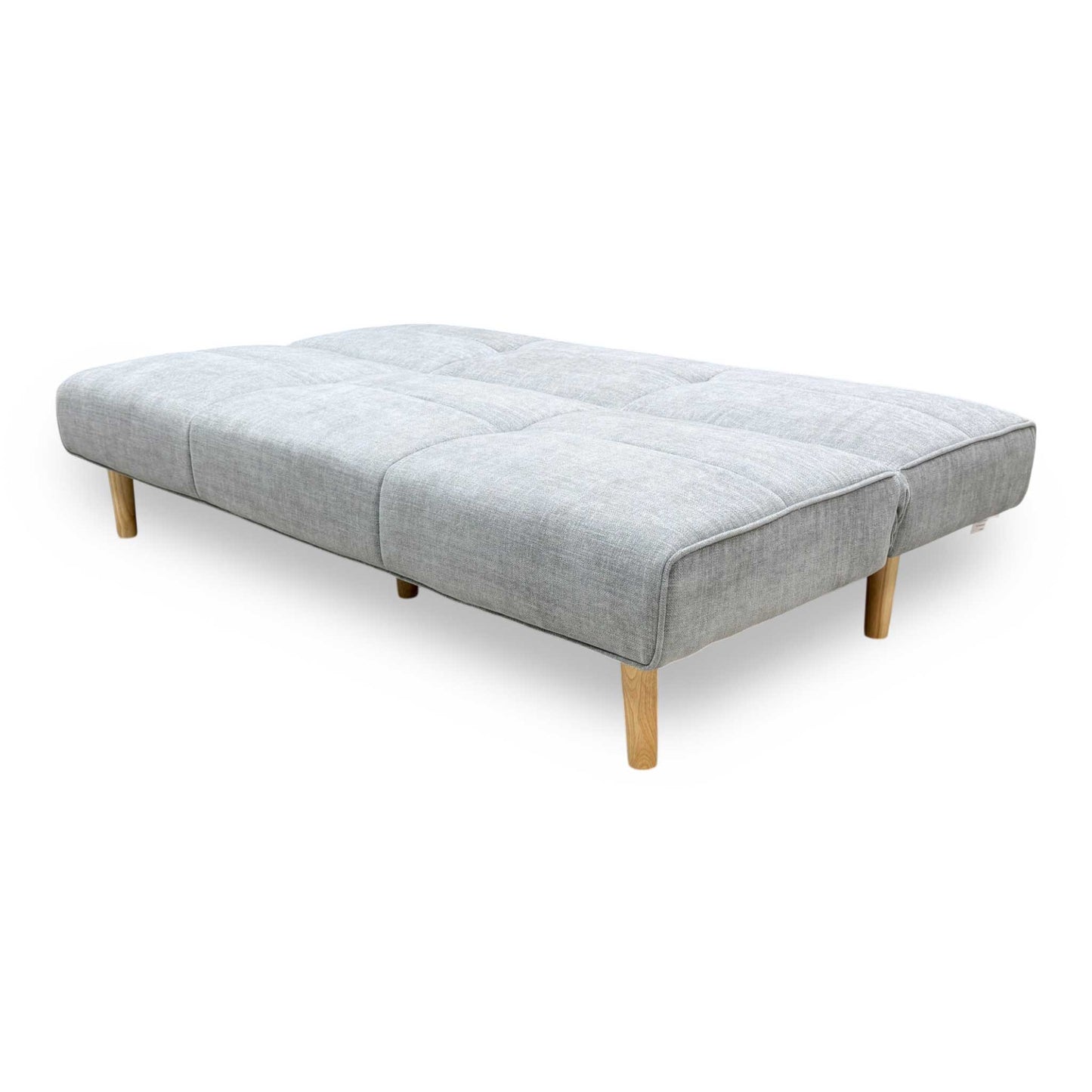 Side profile of the ‘Miyagi’ fabric futon, highlighting its neat armless silhouette and perfectly angled backrest designed for compact living spaces.
