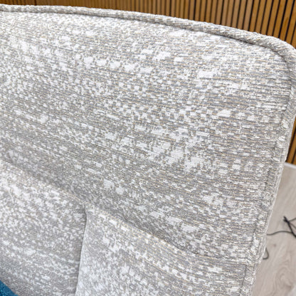 Close-up shot of the Maddox Smoke fabric upholstery on the ‘Maribo’ chair, showcasing the premium textured weave and sophisticated, neutral grey coloration.