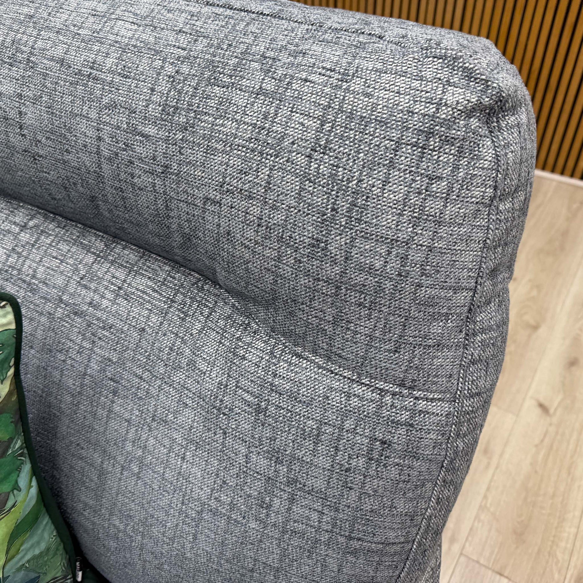 Close-up shot of the Dash Blue fabric upholstery on the ‘Hudson 23’ armchair, showcasing the subtle, multi-tonal blue woven pattern and durable texture.