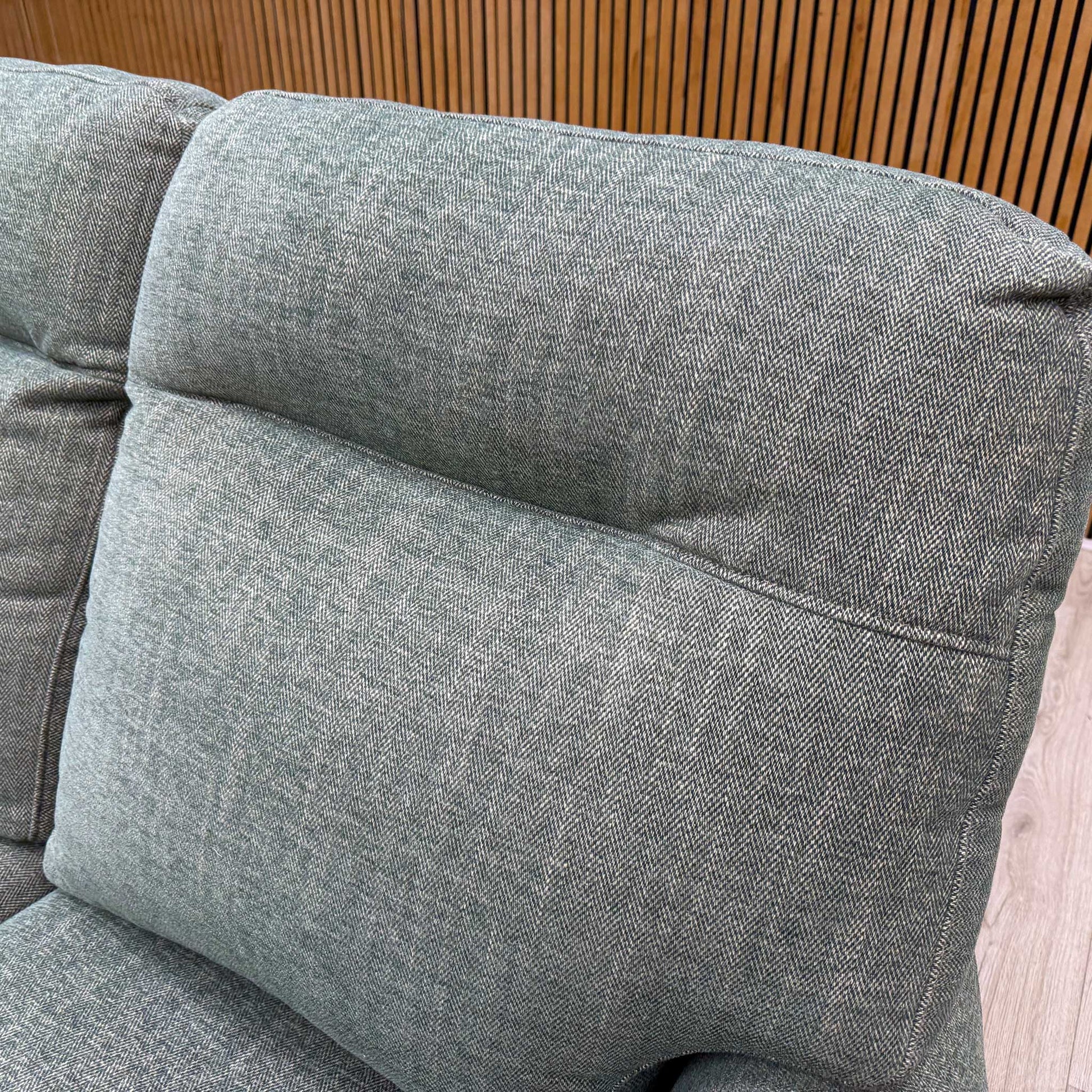 Close-up shot of the Sierra Conifer Green fabric upholstery on the ‘Hudson 23’ sofa, showcasing the rich, deep green tone and durable, high-end weave texture.