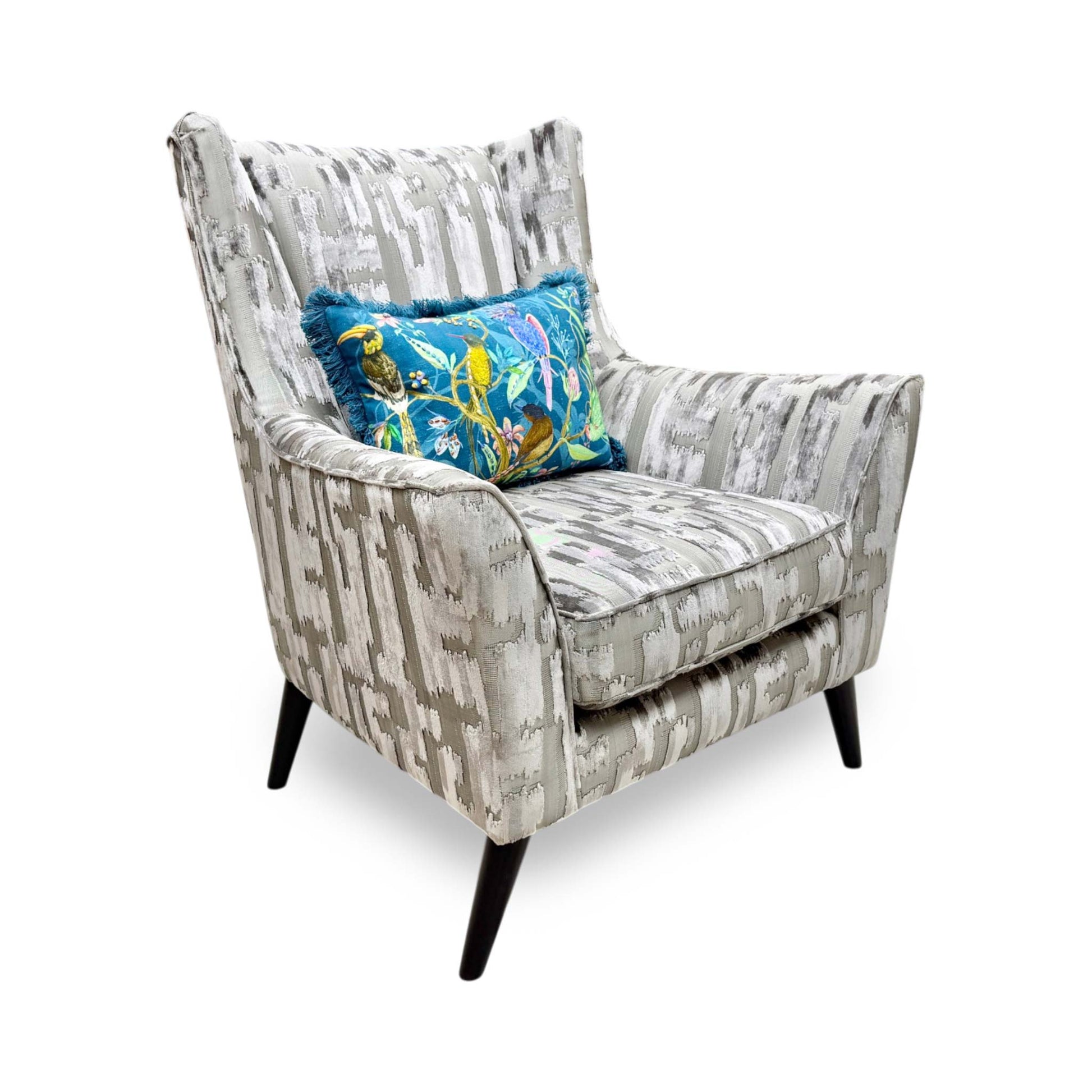Full view of the Furniture Village Boutique ‘Allure’ Wing Chair in Iron patterned fabric, showcasing its high, supportive winged silhouette, gently curved arms, and elegant modern styling.
