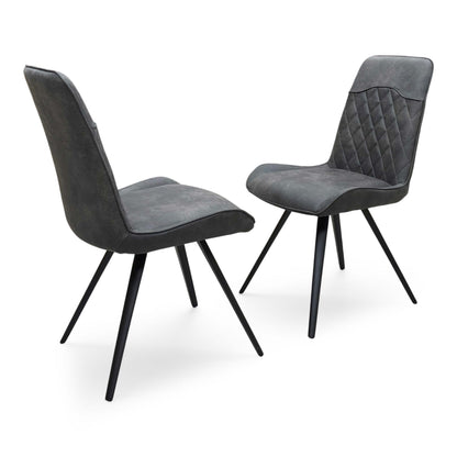 Side profile of the ‘Warrior’ dining chair, highlighting the clean, continuous curve of the matte black powder-coated cantilever base and the ergonomic slant of the backrest.