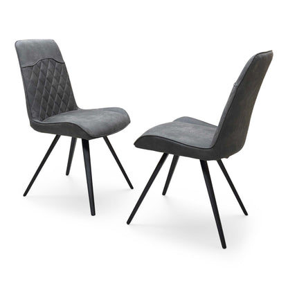 Side profile of the ‘Warrior’ dining chair, highlighting the clean, continuous curve of the matte black powder-coated cantilever base and the ergonomic slant of the backrest.