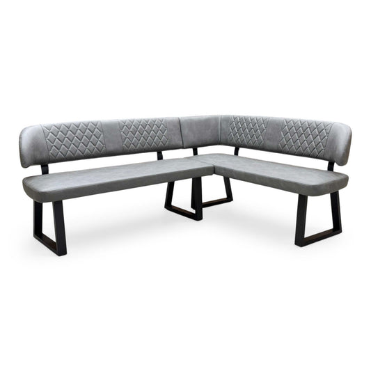 Front view of the ‘Venus’ Right-Hand Facing Corner Dining Bench in Grey faux leather, showcasing its modern L-shaped design, vertical channel-stitched backrest, and sleek black metal legs.