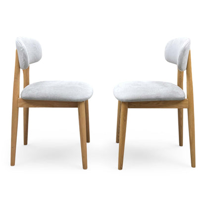 Front view of a pair of ‘Stockholm’ Dining Chairs in Light Oak, showcasing their clean Scandinavian design, minimalist slatted backrests, and smooth contoured wooden seats.