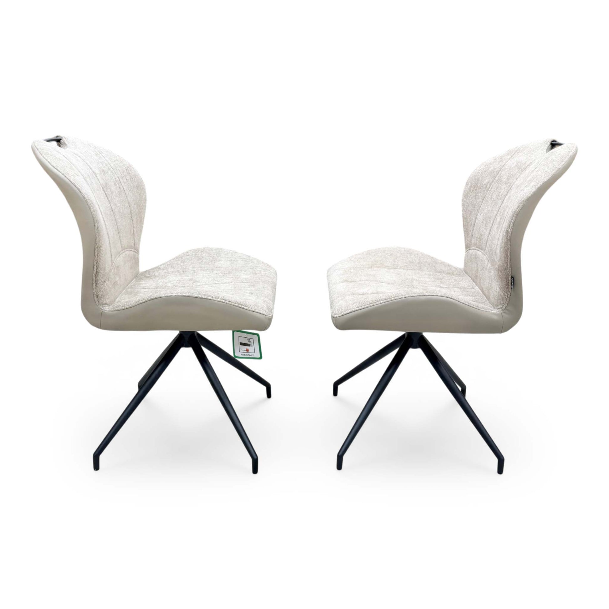 Side profile view of the Raul pebble taupe dining chair, illustrating the supportive seat scoop, padded cushion thickness, and modern leg angles.
