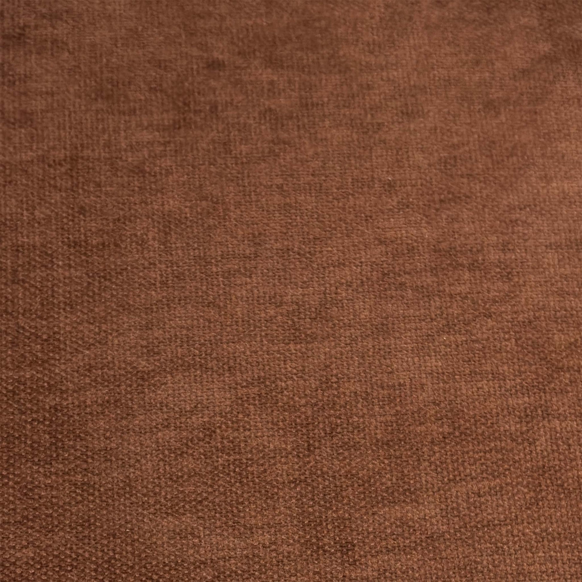 Close-up shot of the Rust Orange fabric on the ‘Jai’ chair, showcasing the neat vertical column stitching, premium tailored edges, and soft, resilient textured weave.