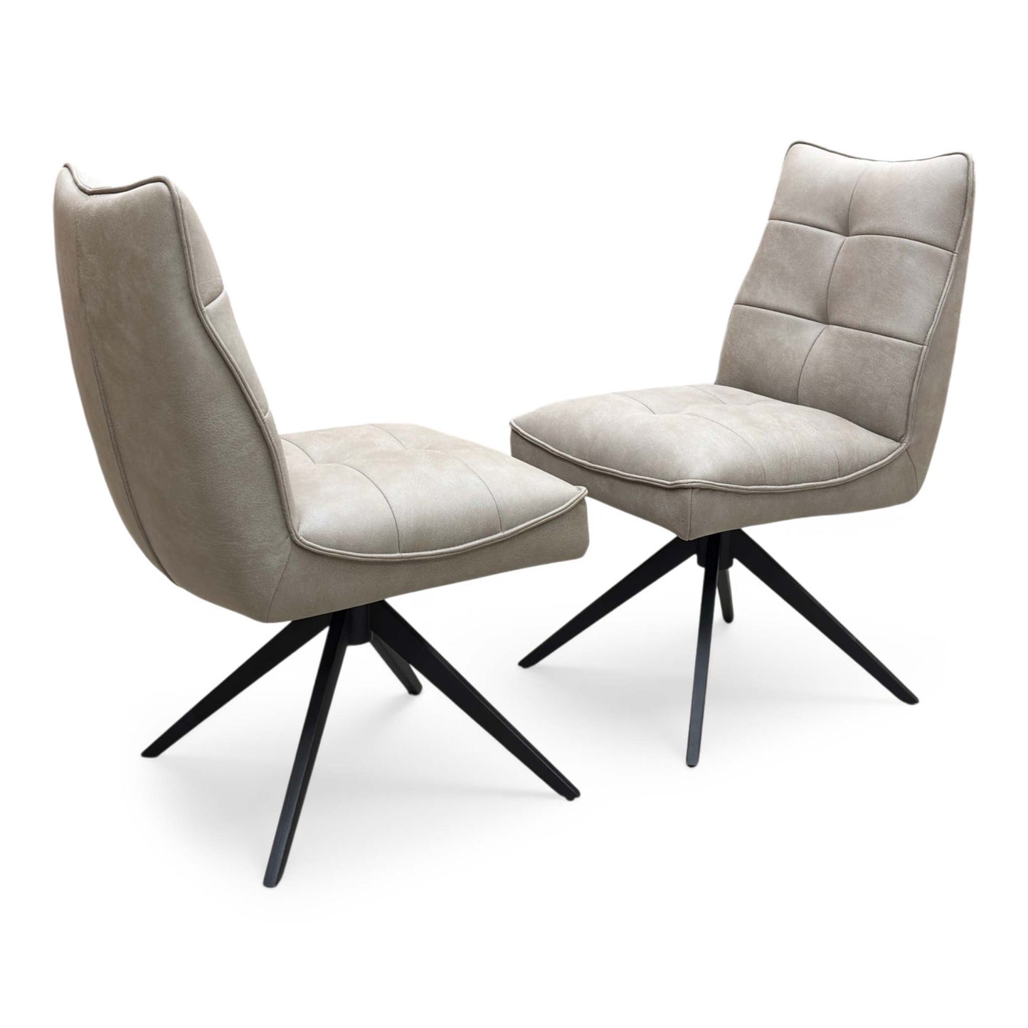 Full view of a pair of ‘Germain’ Swivel Dining Chairs in Taupe faux leather, showcasing their sleek contemporary scoop silhouettes, vertical channel stitching, and elegant black metal legs.