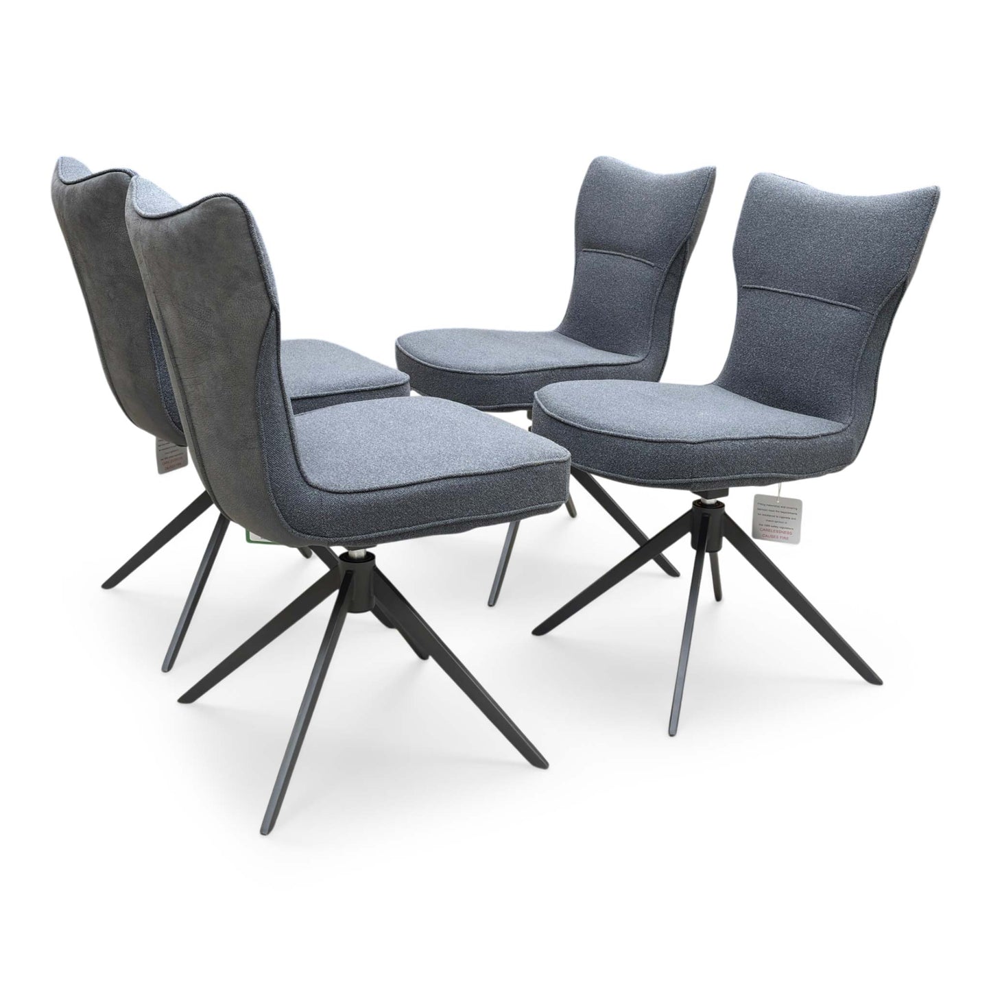 Side profile of the ‘Carrera’ dining chair, highlighting its ergonomic sloped backrest, integrated low armrests, and clean, angled black metal leg design.