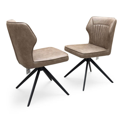 Full view of a pair of ‘Aydin’ Swivel Dining Chairs in Tan Brown faux leather, showcasing their contemporary curved bucket seats, vertical stitched detailing, and sleek black metal spider legs.