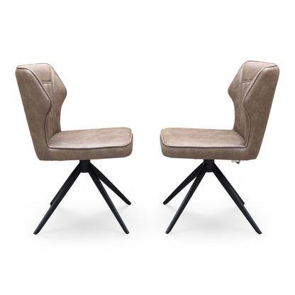 Front view of a pair of ‘Aydin’ Swivel Dining Chairs in Tan Brown faux leather, showcasing their contemporary curved bucket seats, vertical stitched detailing, and sleek black metal spider legs.