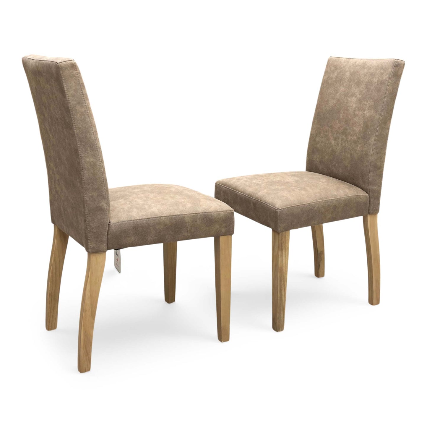 Full view of a pair of Furnitureland ‘Augusta’ Dining Chairs in Taupe Cowboy fabric, showcasing their contemporary diamond-stitched quilted backs, supportive scoop silhouettes, and sleek black metal legs.