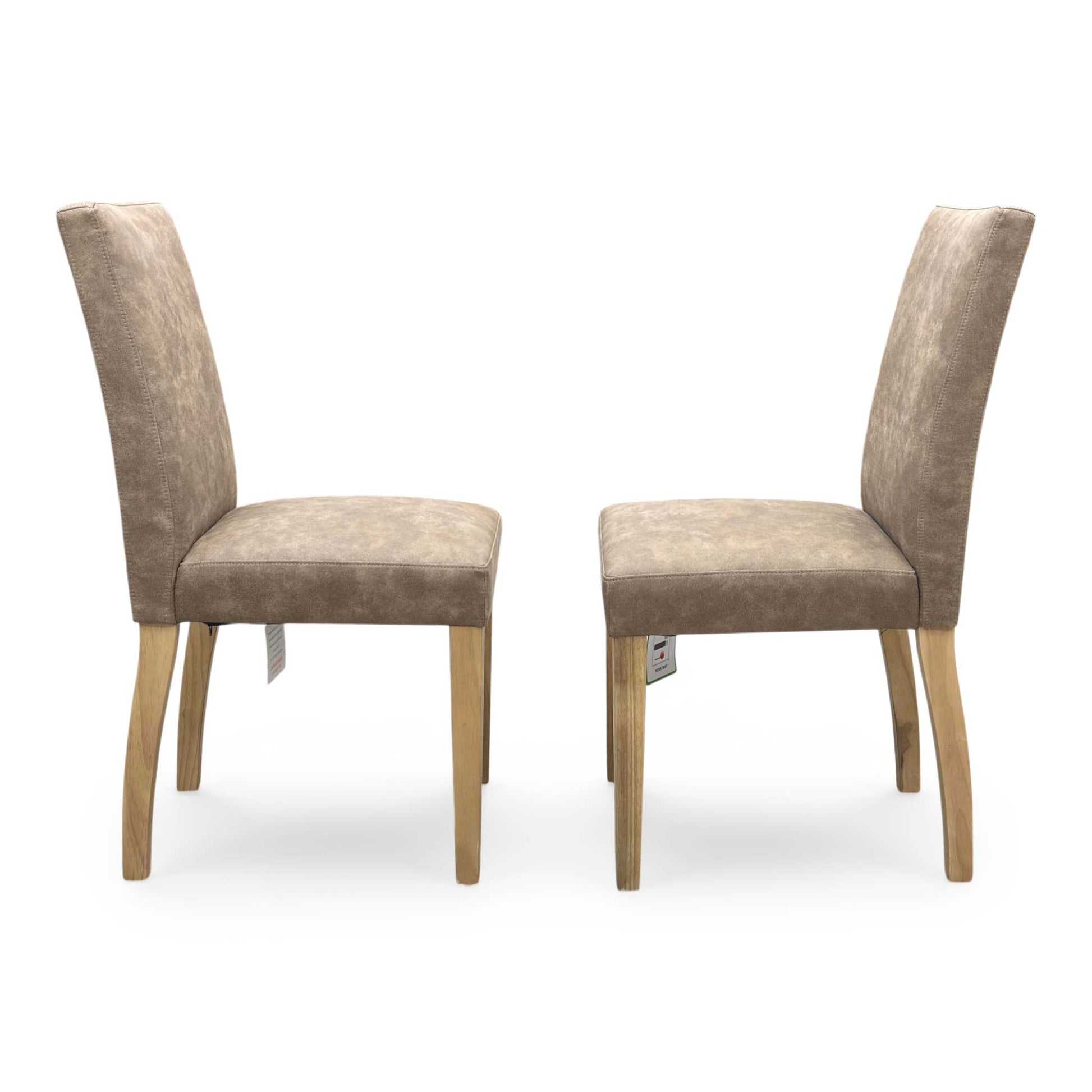 Front view of the ‘Augusta’ dining chair, emphasizing the comfortable deeply padded seat cushion and the elegant contrast between the warm taupe upholstery and dark legs.