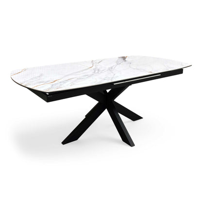 Side profile of the ‘Raul’ modern dining table, highlighting the slim, low-profile ceramic tabletop edge and the clean angles of the black powder-coated legs.
