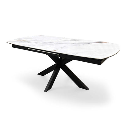 Side profile of the ‘Raul’ modern dining table, highlighting the slim, low-profile ceramic tabletop edge and the clean angles of the black powder-coated legs.