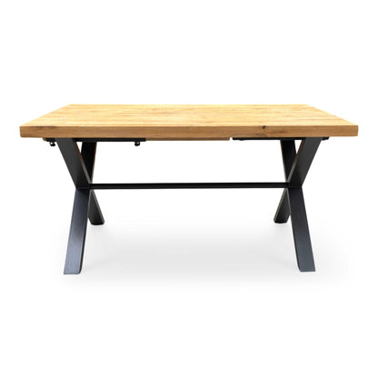 Front  profile of the ‘Earth’ industrial dining table, highlighting the clean, angular lines of the grey metal X-frame legs and the sturdy overhanging oak top.