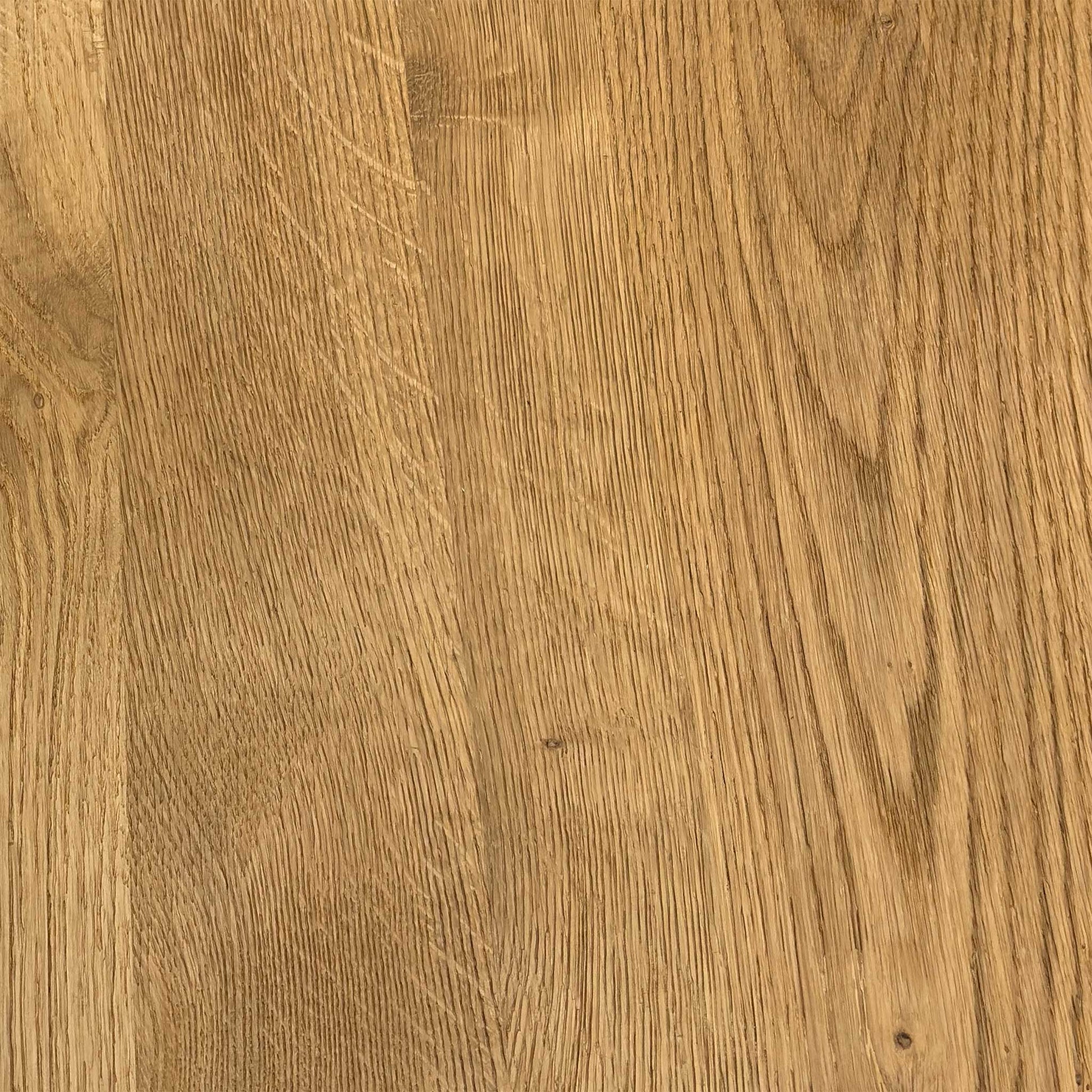 Close-up shot of the solid natural oak table top on the ‘Earth’ dining table, showcasing the rich wire-brushed texture, distinctive natural character markings, and oiled finish.
