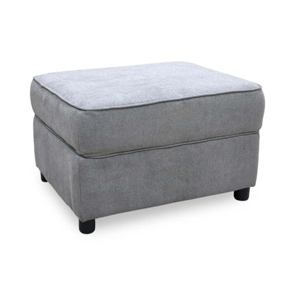 Side view of the Comfi light grey fabric storage footstool, illustrating the structural frame height, crisp corner lines, and robust compact build.