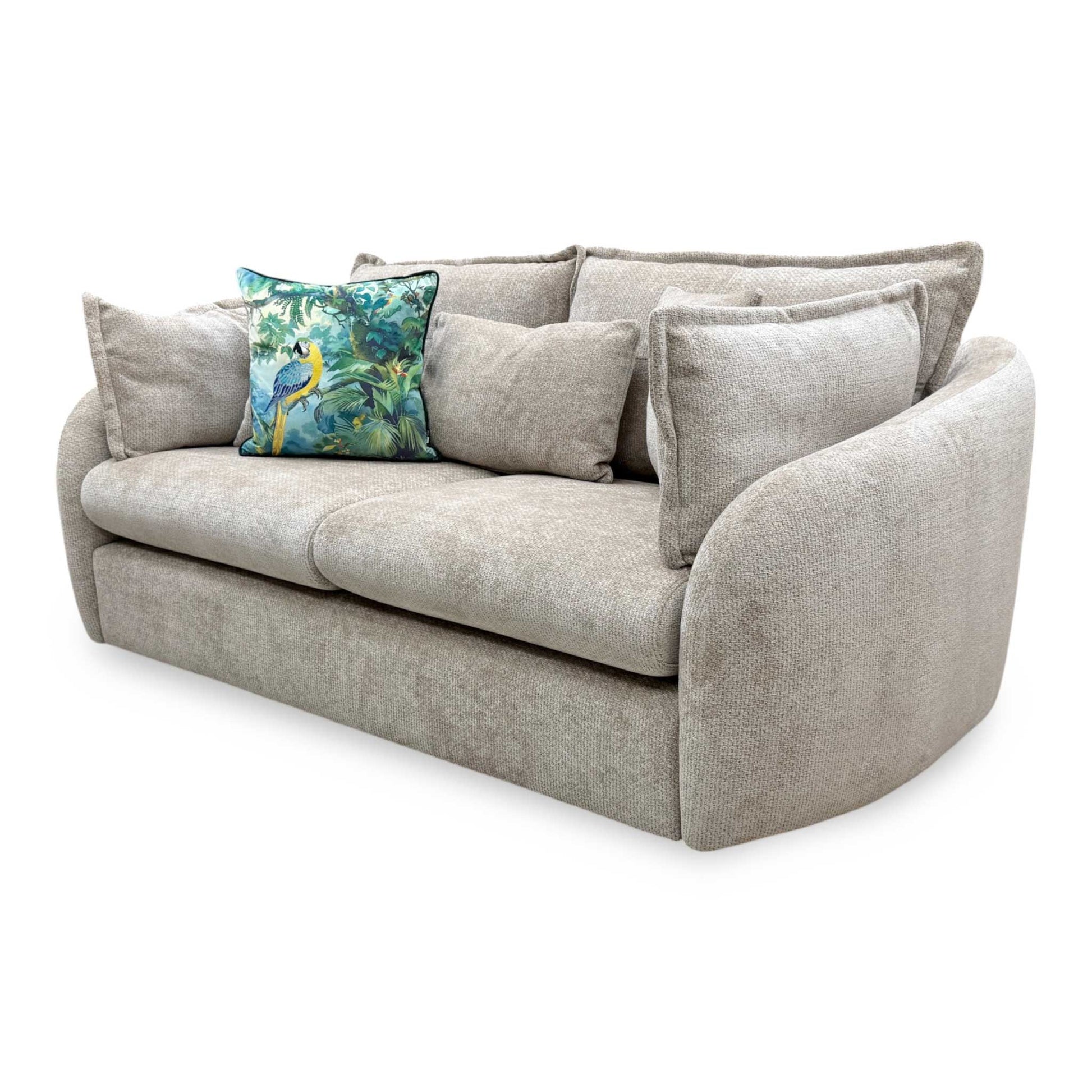 Three-quarter angled view of the Portobello stone wicker fabric 3-seater couch, highlighting the contoured armrests, structured profile, and modern living room aesthetic.
