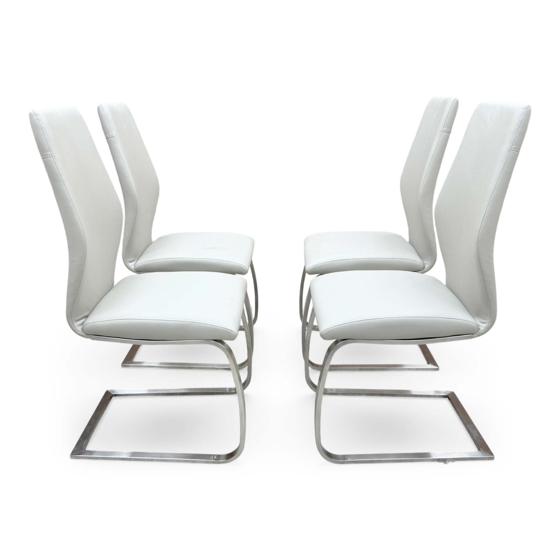 Side view for the Elis taupe dining chairs, highlighting the wipe-clean faux leather upholstery, ergonomic back support, and sturdy cantilever frame.